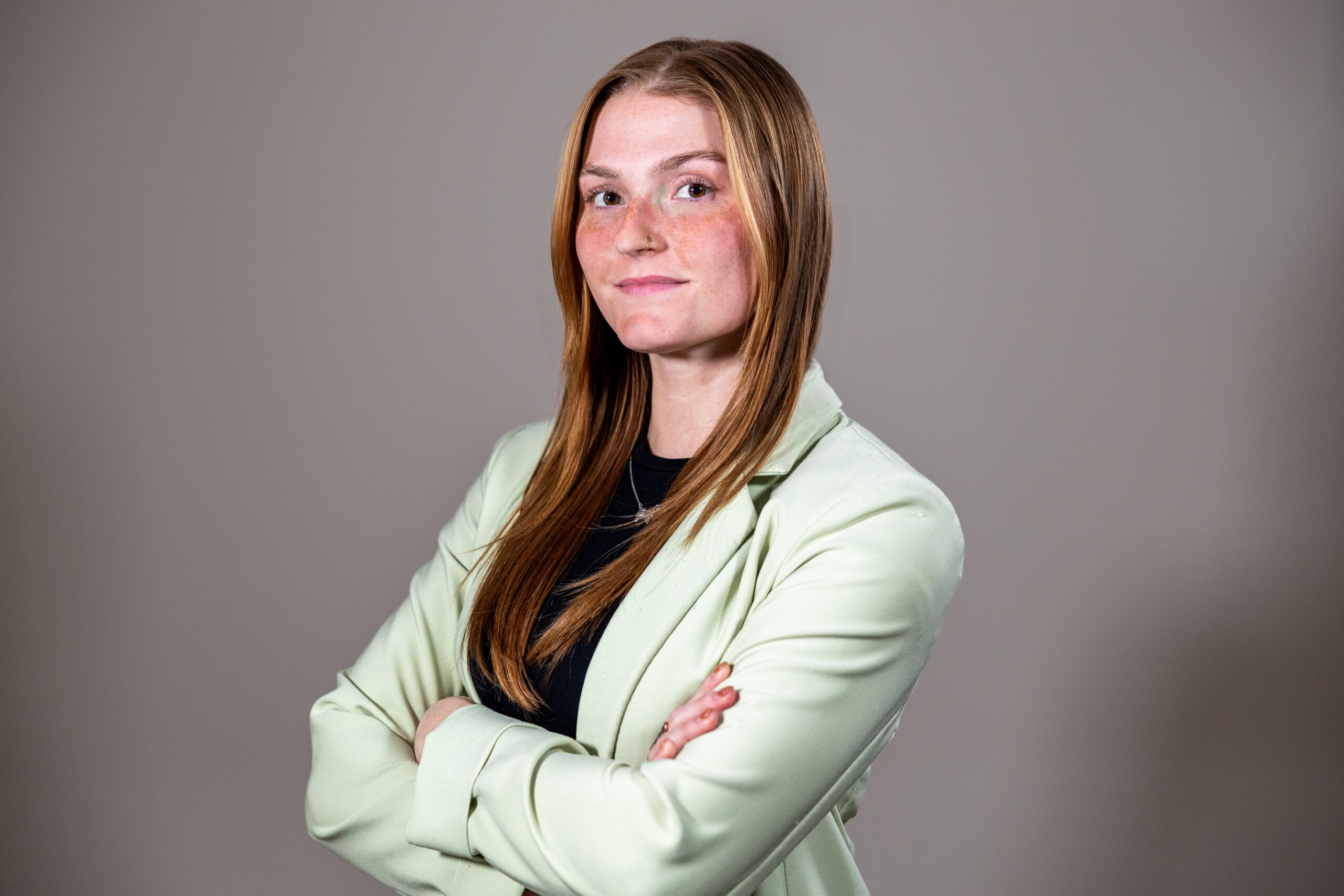 Lenna Kidd Professional headshot of Director of Marketing exuding confidence, sharp style, and a dynamic, approachable personality