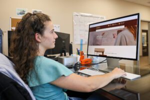 Graphic Designer at Work – Ink & Arrow Creating Web Design for Hemlock Flooring - Ink & Arrow Marketing Co. Website Design & Creation Services by Ink & Arrow in Berwick, PA