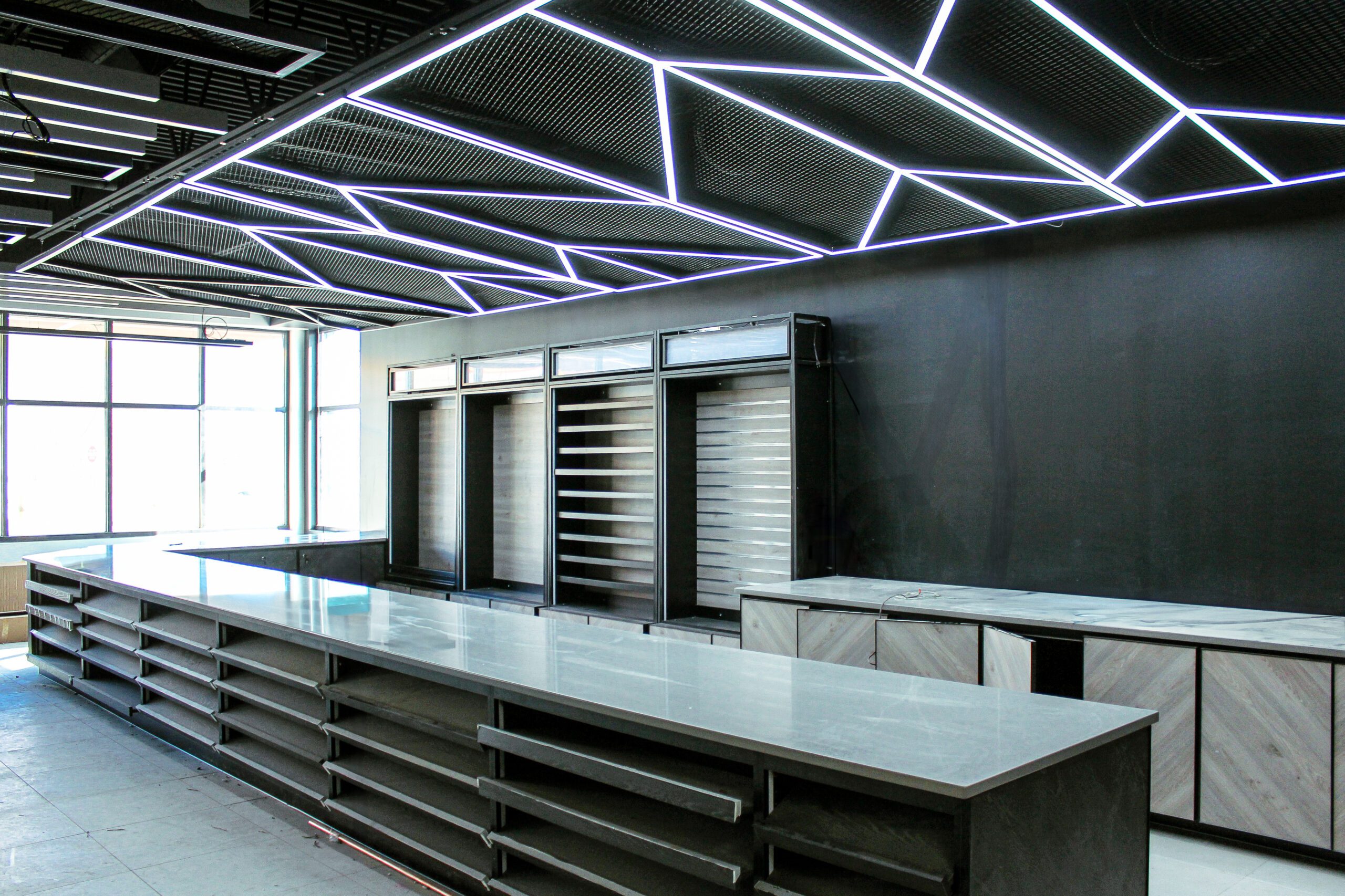 Remodeled interior room featuring modern lighting fixtures and updated design elements