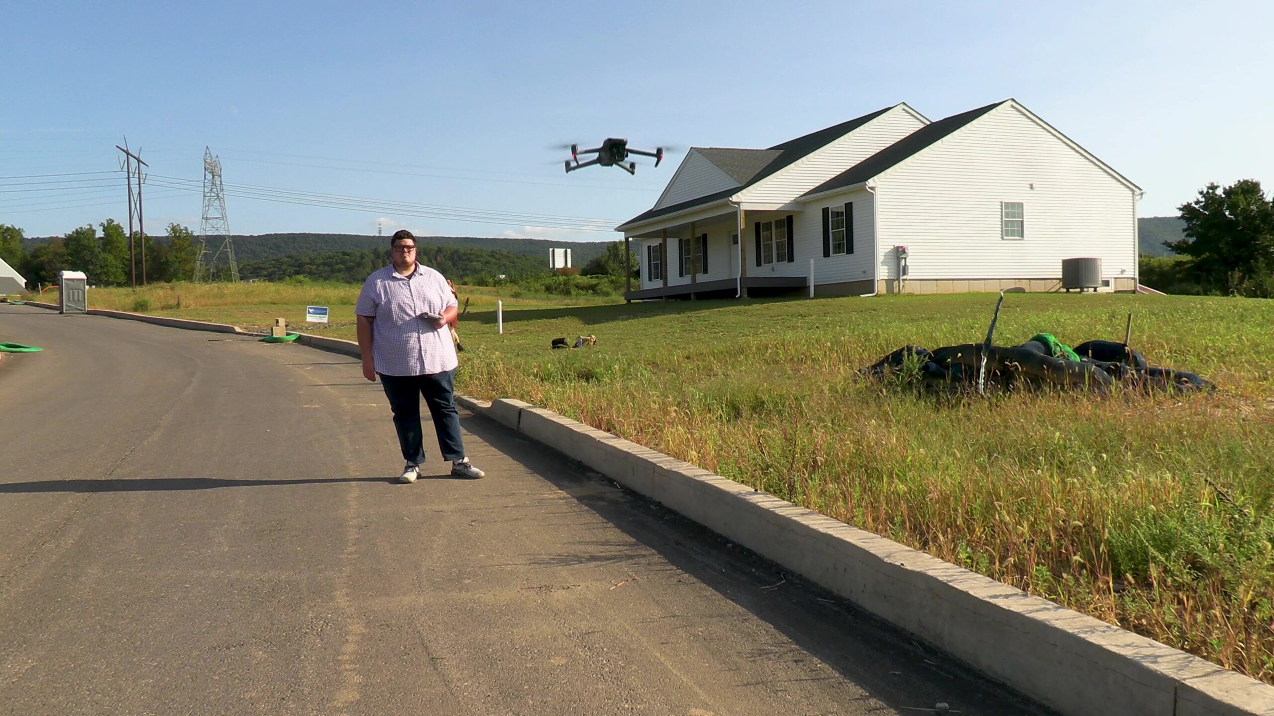 Drone technician prepping drone for aerial photography and video capture