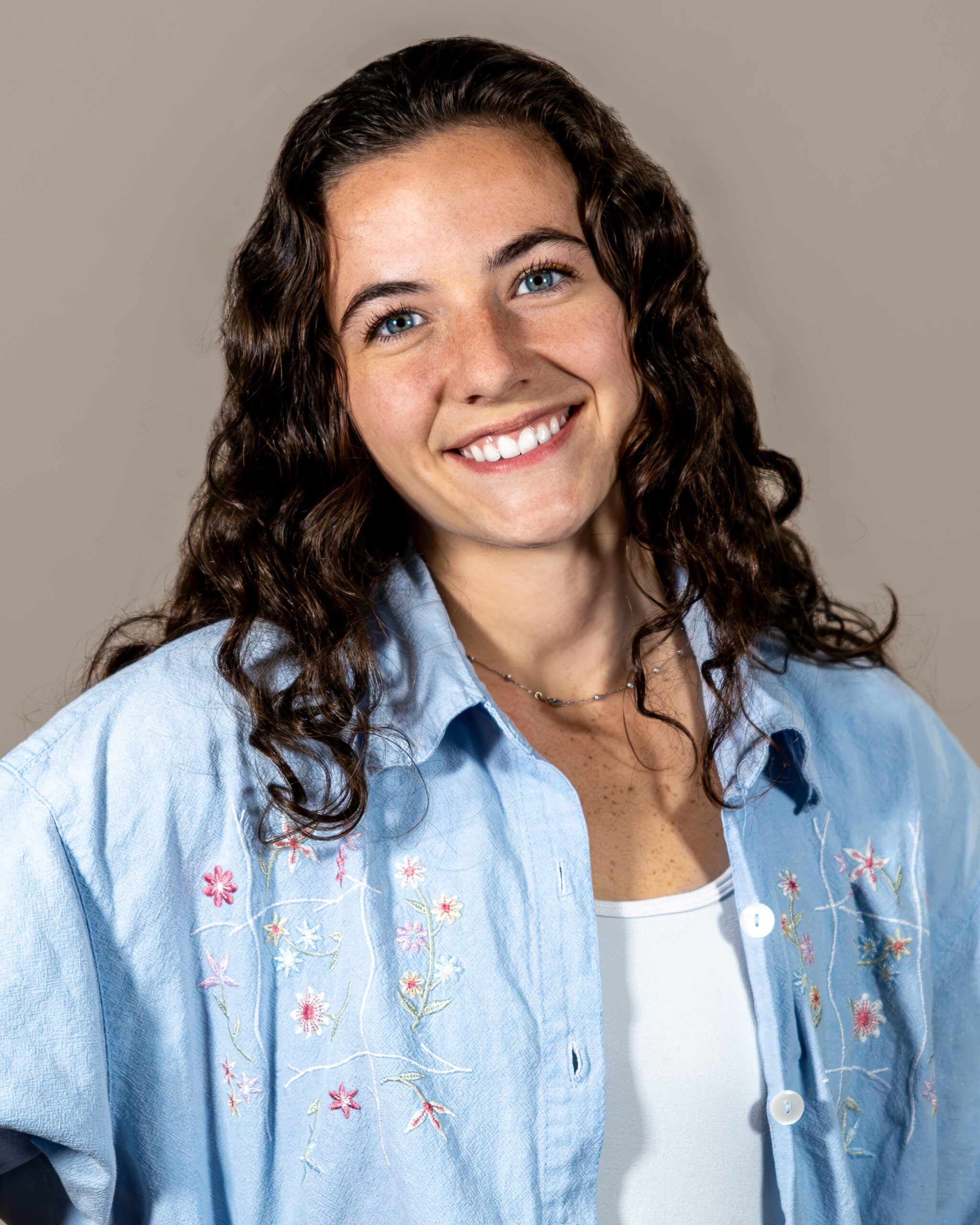 Headshot of Jessica Kline, Graphic Designer, showcasing her dedication to excellence and unmatched creative work ethic