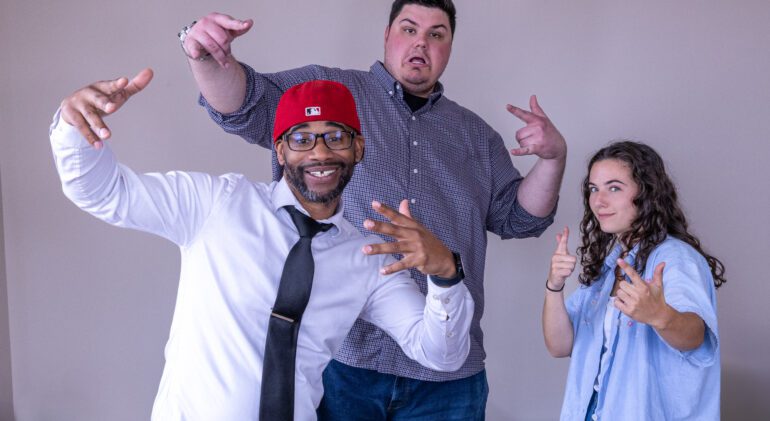 Ink & Arrow team sharing a laugh during headshot day, capturing creative energy and good vibes