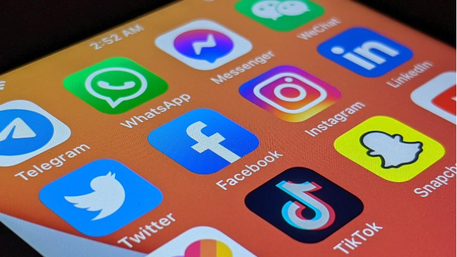 Top Social Media Platforms Optimized with AIOSEO Scoring Guidelines - Ink & Arrow Marketing Co. Social media icons on phone screen using AIOSEO scoring guidelines for optimization
